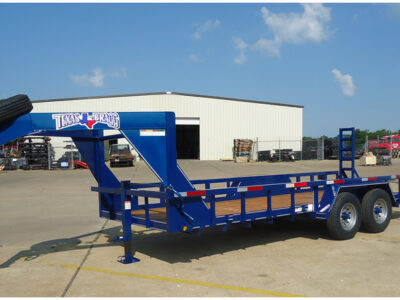 Texas Bragg gooseneck trailer parked outdoors, showcasing heavy-duty construction and durable design available for sale at in Tyler, Texas.