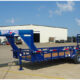 Texas Bragg gooseneck trailer parked outdoors, showcasing heavy-duty construction and durable design available for sale at  in Tyler, Texas.