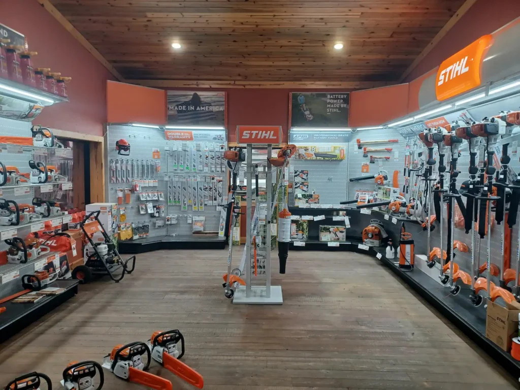 STIHL equipment showroom at  in Lindale, Texas, with chainsaws, trimmers, blowers, mowers, accessories, and other outdoor power equipment on display.